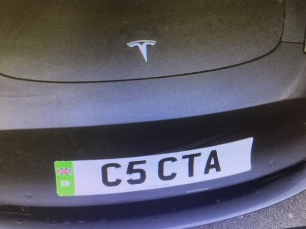Tesla with Stick-on Numberplate